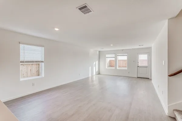 a view of a kitchen with a sink and a window
