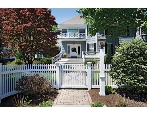 144 Nehoiden Road Newton, MA 02468 - Photo 2 of 17 a front view of a house with a garden