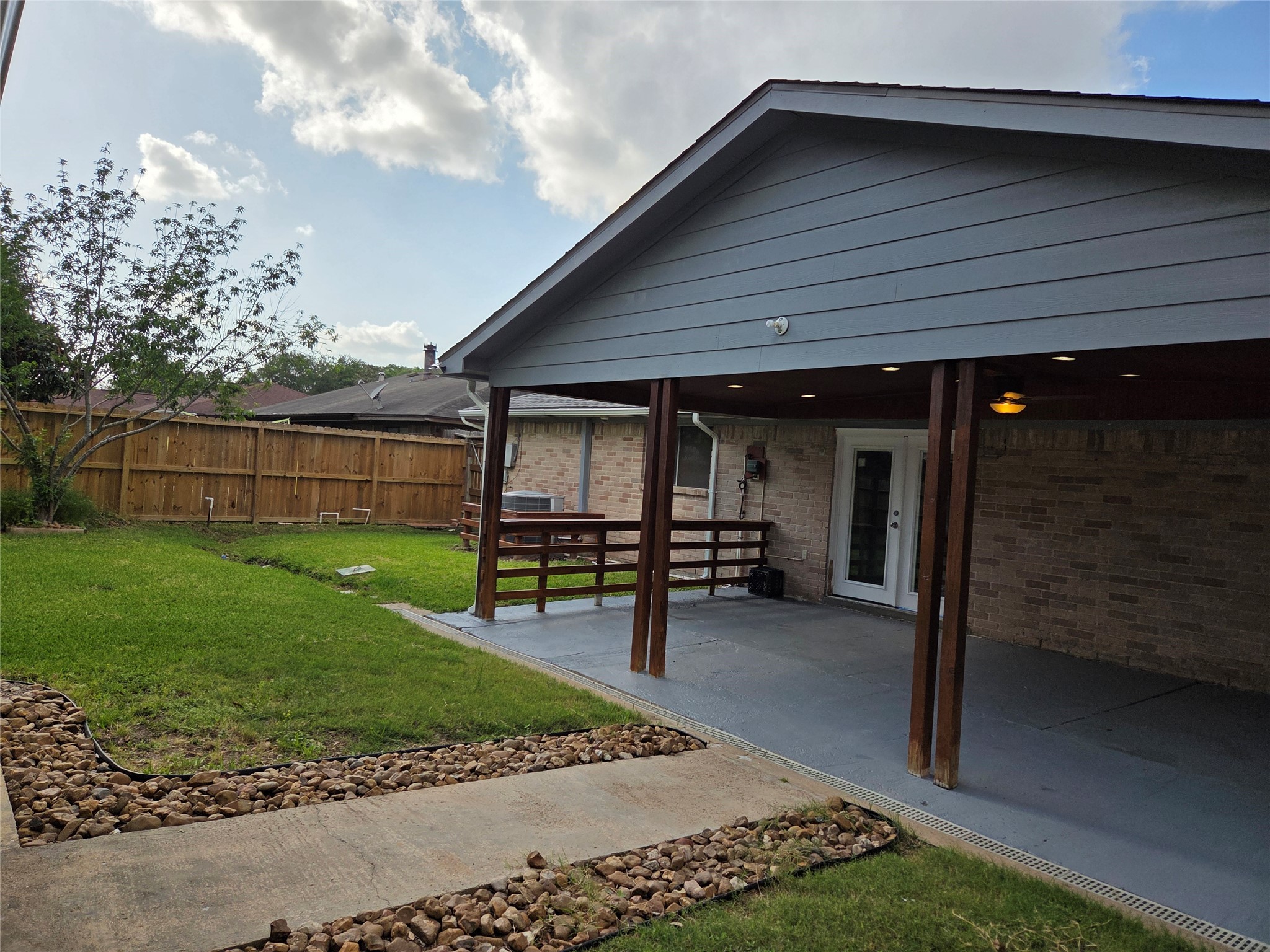 15415 Beechnut Street Houston, TX 77083 - Photo 21 of 28 a view of a house with a yard