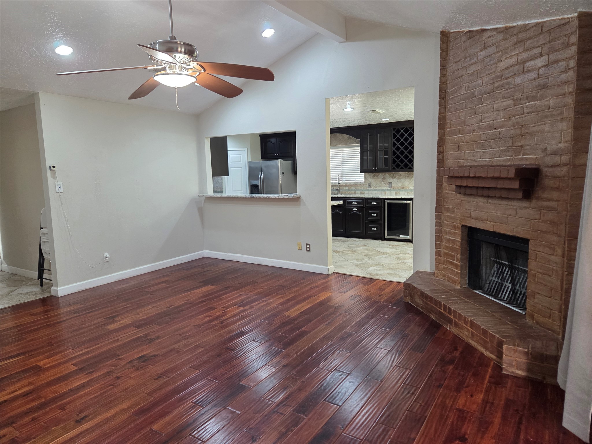 15415 Beechnut Street Houston, TX 77083 - Photo 4 of 28 wooden floor fireplace and windows in an empty room