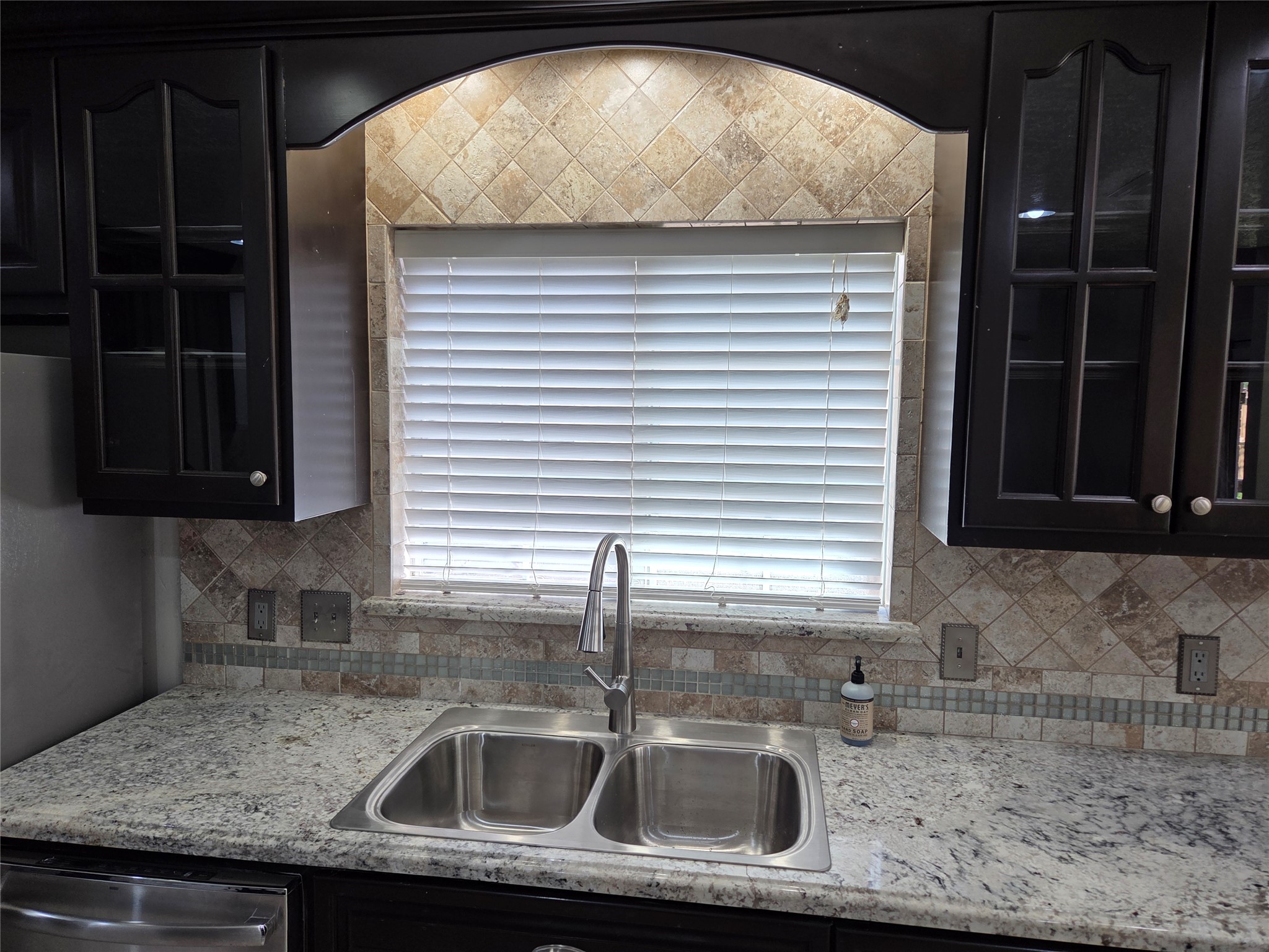 15415 Beechnut Street Houston, TX 77083 - Photo 6 of 28 a kitchen with a sink and cabinets
