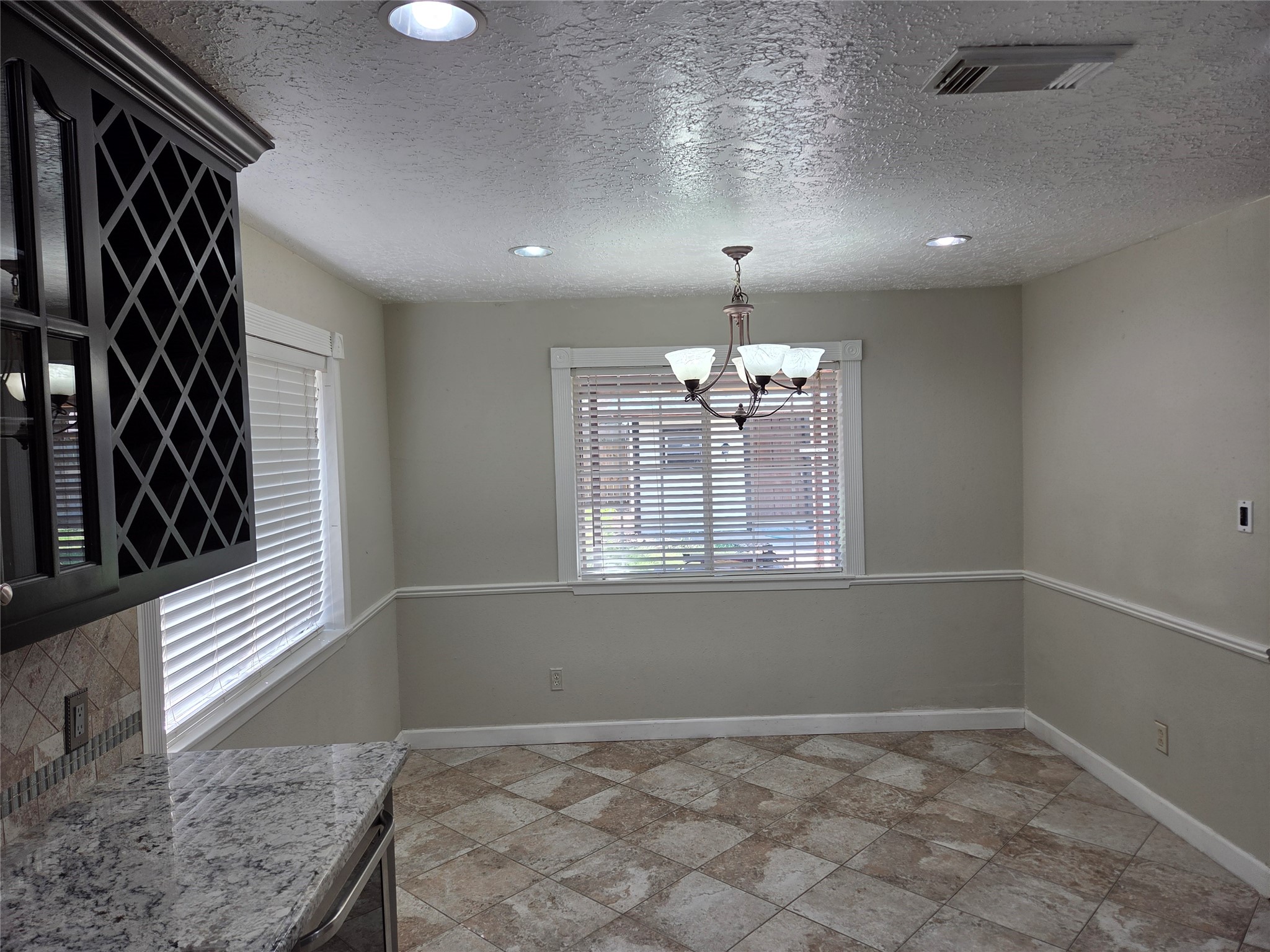 15415 Beechnut Street Houston, TX 77083 - Photo 7 of 28 a view of an empty room and window