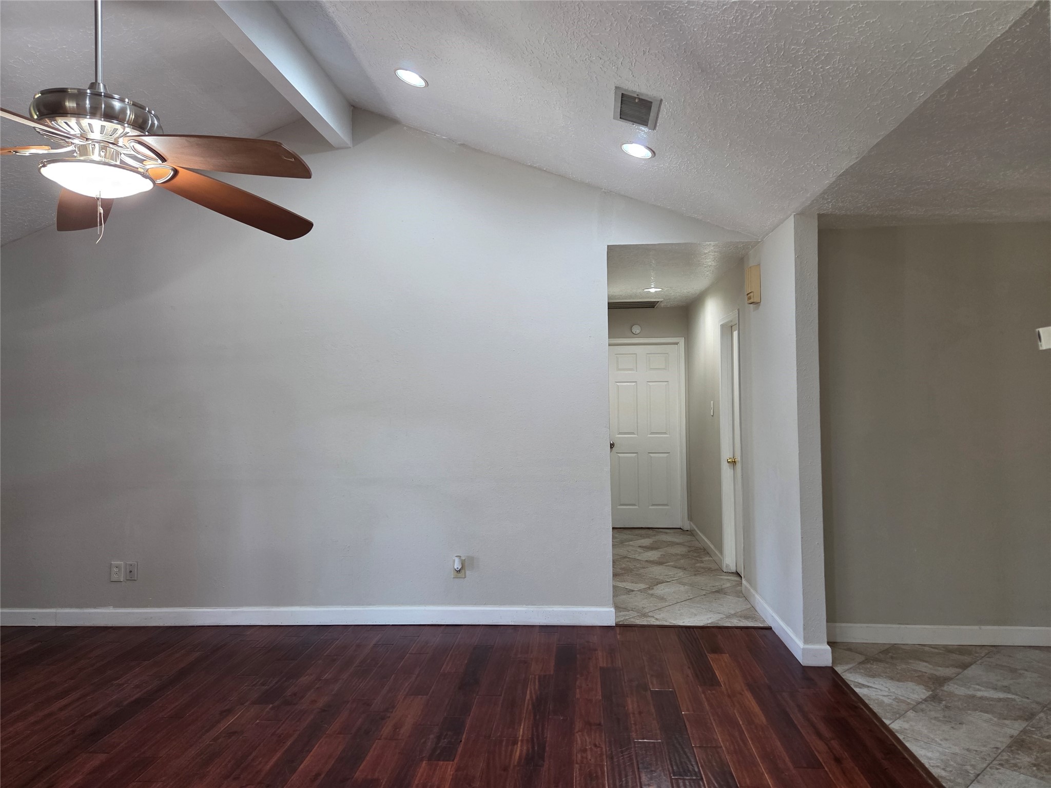 15415 Beechnut Street Houston, TX 77083 - Photo 10 of 28 wooden floor in an empty room with a window