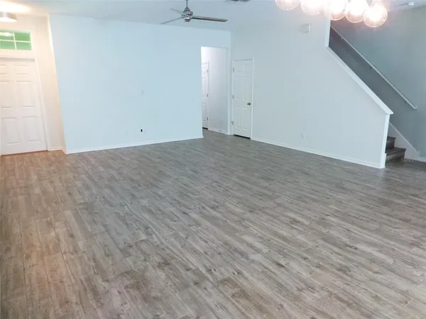 an empty room with wooden floor
