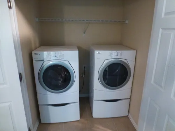 a utility room with dryer and washer