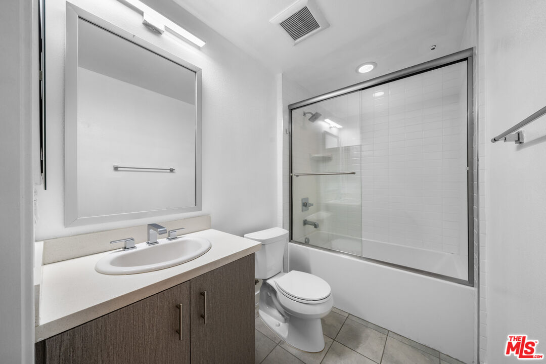 436 South Virgil Avenue, Unit 407 Los Angeles, CA 90020 - Photo 4 of 16 a bathroom with a sink a toilet and shower