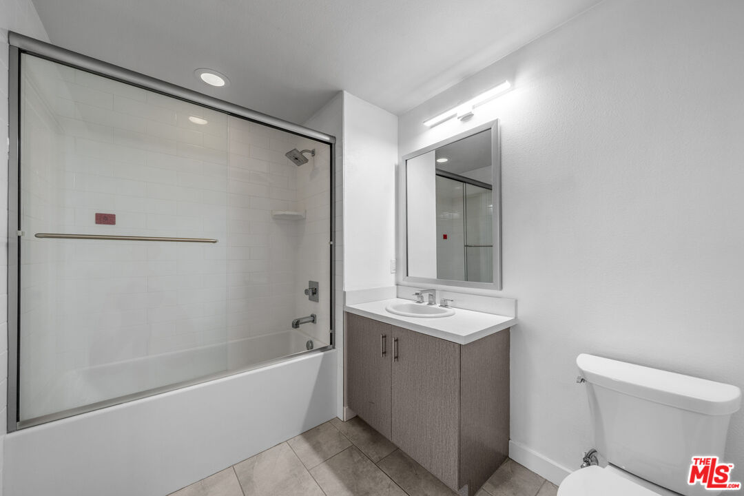 436 South Virgil Avenue, Unit 407 Los Angeles, CA 90020 - Photo 6 of 16 a bathroom with a sink mirror toilet and bathtub