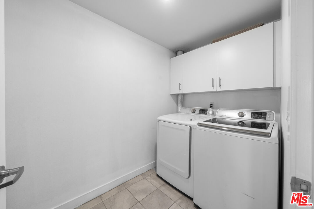 436 South Virgil Avenue, Unit 407 Los Angeles, CA 90020 - Photo 8 of 16 a view of a storage and utility room with washer and dryer