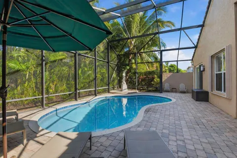 a view of a swimming pool with a patio