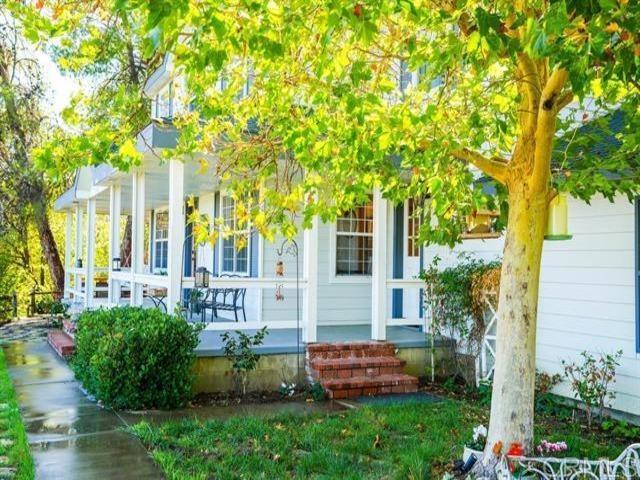 27303 Center Loop Santa Ysabel, CA 92070 - Photo 1 of 1 a front view of a house with garden