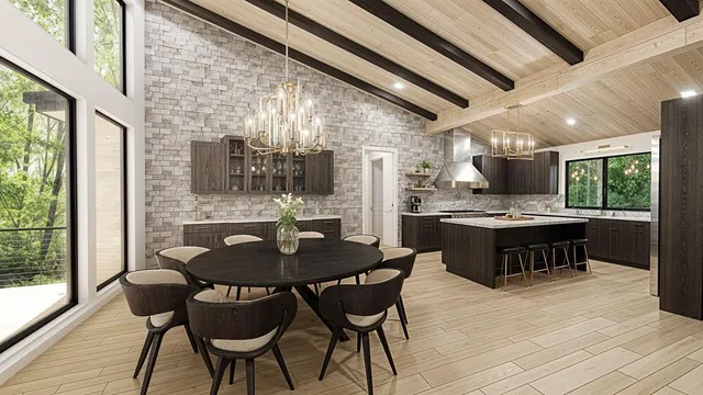 a kitchen with a table chairs a sink dishwasher stove and cabinets with wooden floor