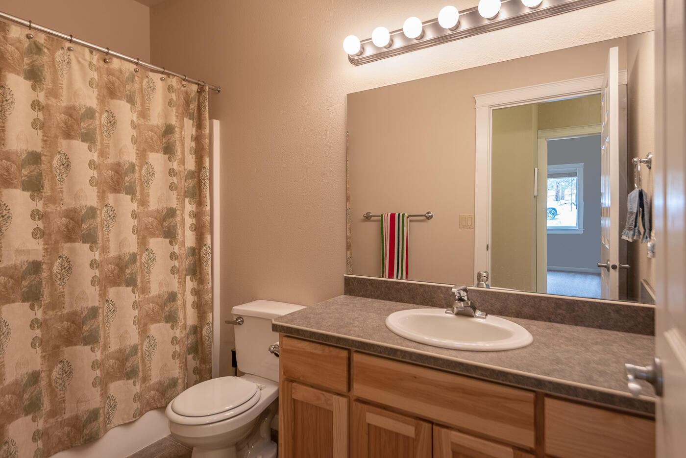 69320 Deer Ridge Road Sisters, OR 97759 - Photo 18 of 39 a bathroom with a sink and a mirror