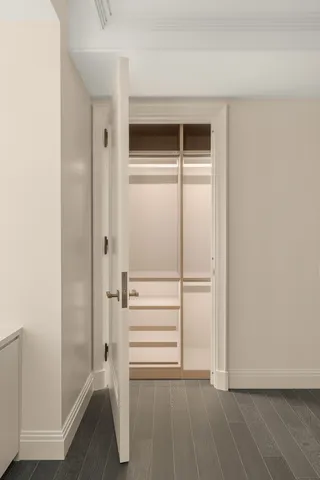 a bedroom with a large bed and a couch