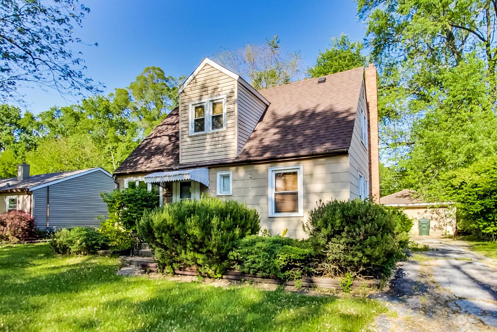 15545 Ridgeway Avenue Markham, IL 60428 - Photo 2 of 28 front view of a house with a yard