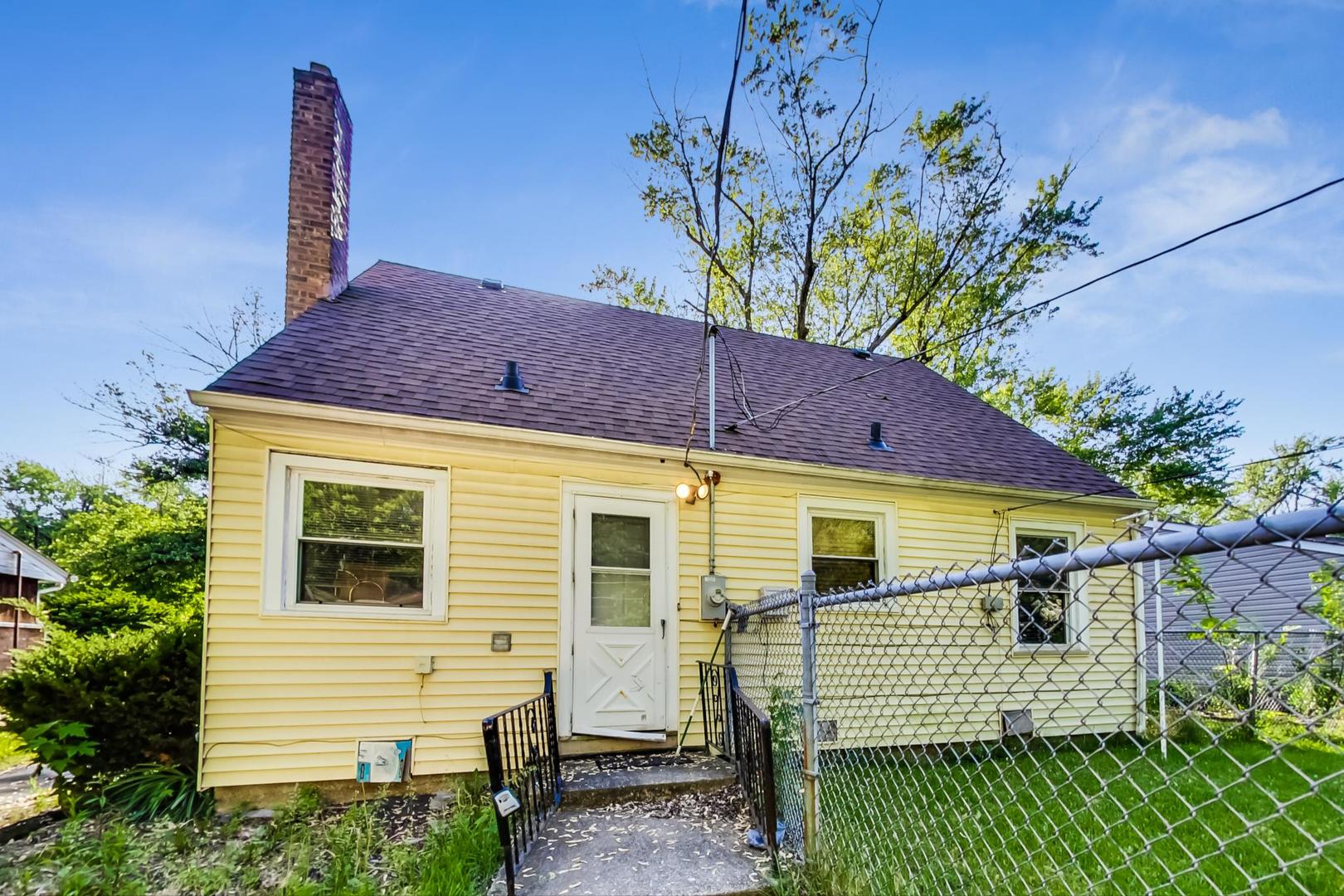 15545 Ridgeway Avenue Markham, IL 60428 - Photo 24 of 28 a view of a house with a yard