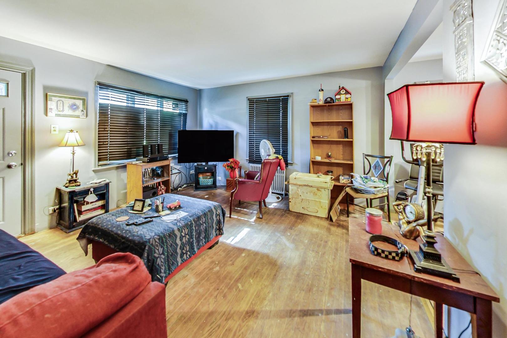 15545 Ridgeway Avenue Markham, IL 60428 - Photo 3 of 28 a living room with furniture and a flat screen tv