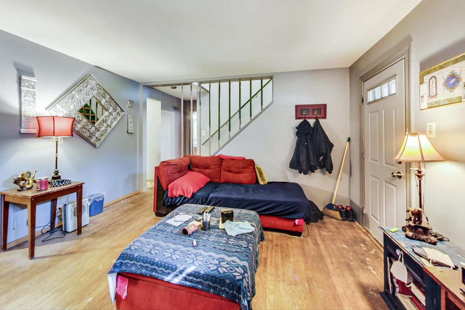 15545 Ridgeway Avenue Markham, IL 60428 - Photo 5 of 28 a living room with furniture and a table