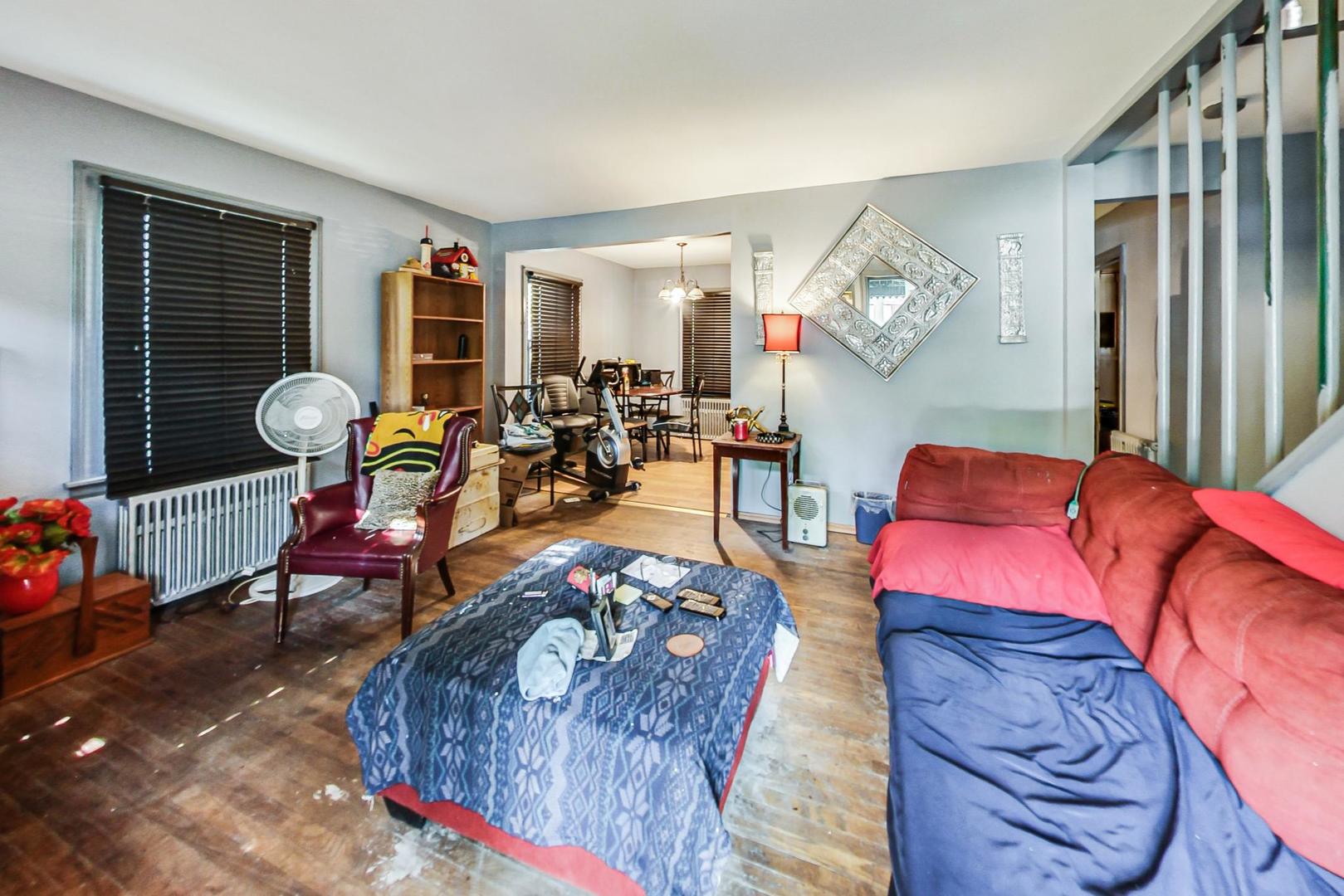 15545 Ridgeway Avenue Markham, IL 60428 - Photo 6 of 28 a living room filled with furniture and a wooden floor