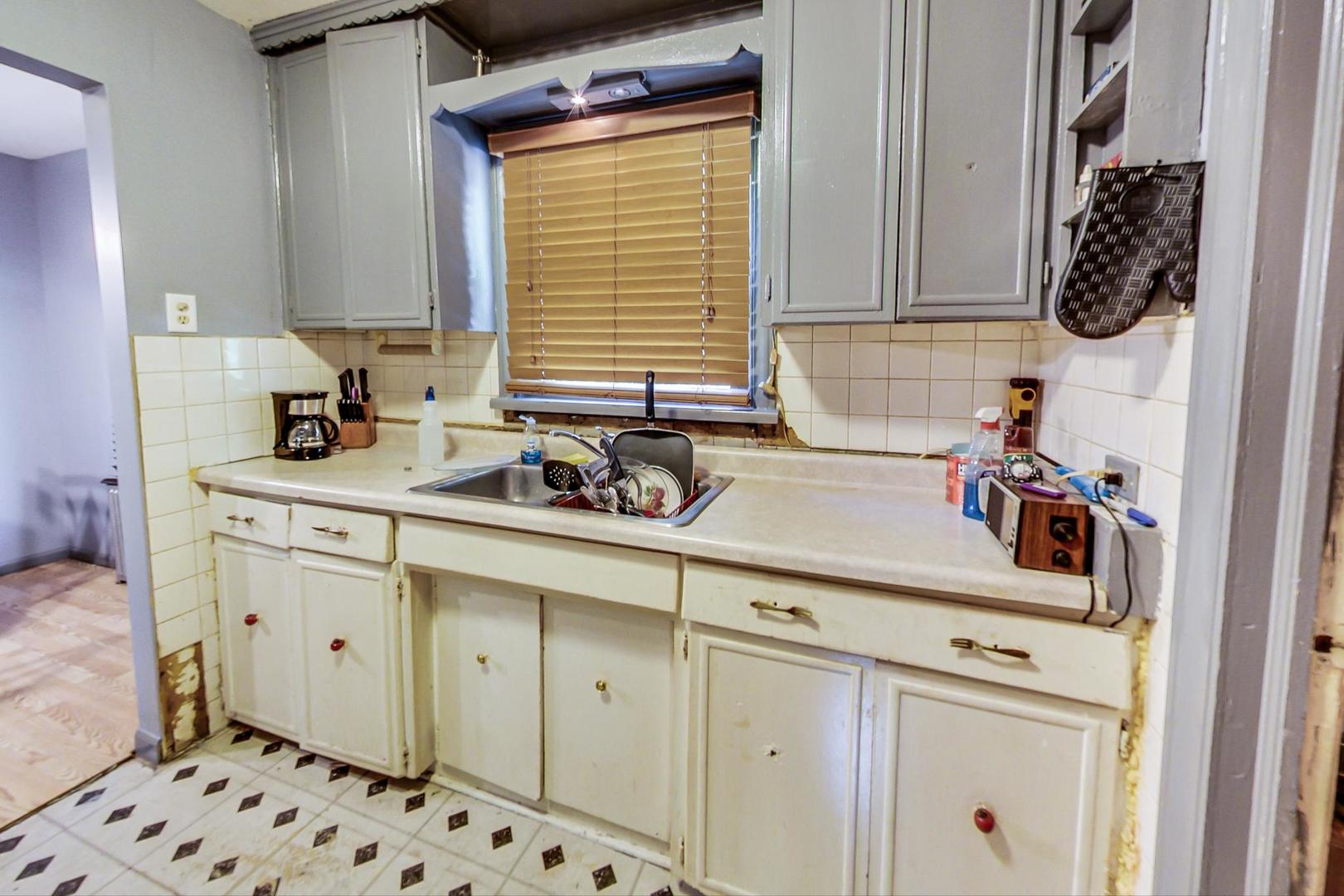 15545 Ridgeway Avenue Markham, IL 60428 - Photo 10 of 28 a kitchen with a sink and cabinets