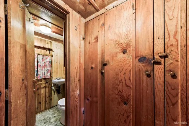 a bathroom with a shower and a sink