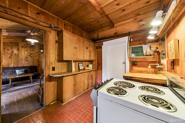 a kitchen with a stove and a refrigerator