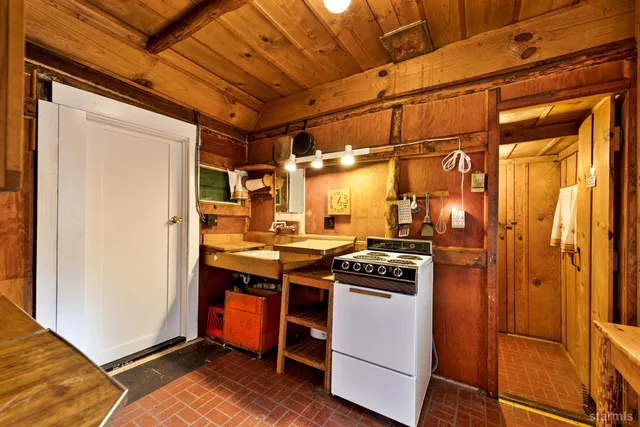 a kitchen with a stove and a refrigerator