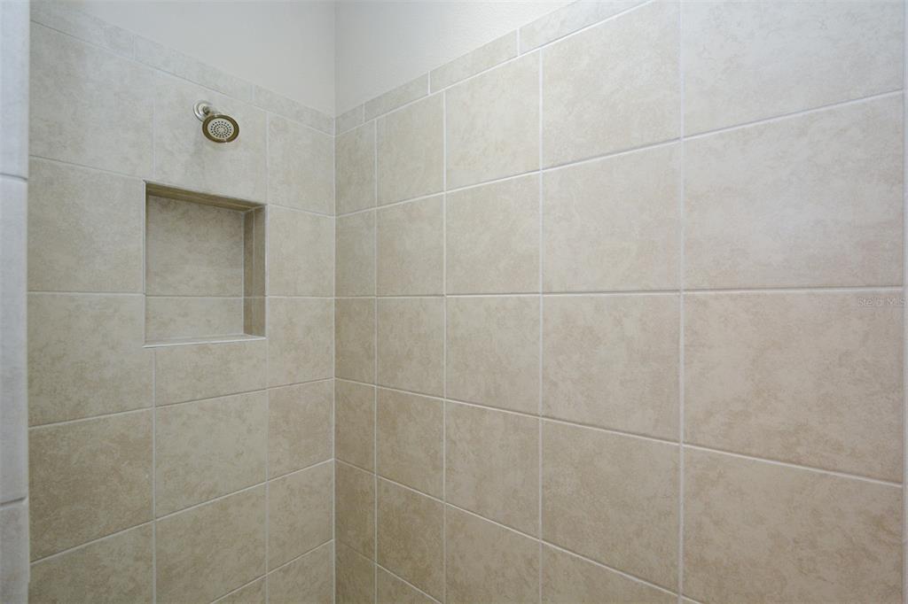 13737 Messina Loop, Unit 202 Lakewood Ranch, FL 34211 - Photo 28 of 49 a bathroom with a shower
