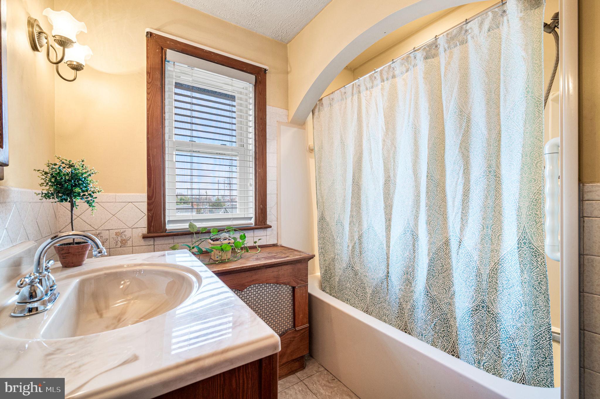 235 Ardmore Avenue Upper Darby, PA 19082 - Photo 13 of 23 a bathroom with a sink and a bathtub