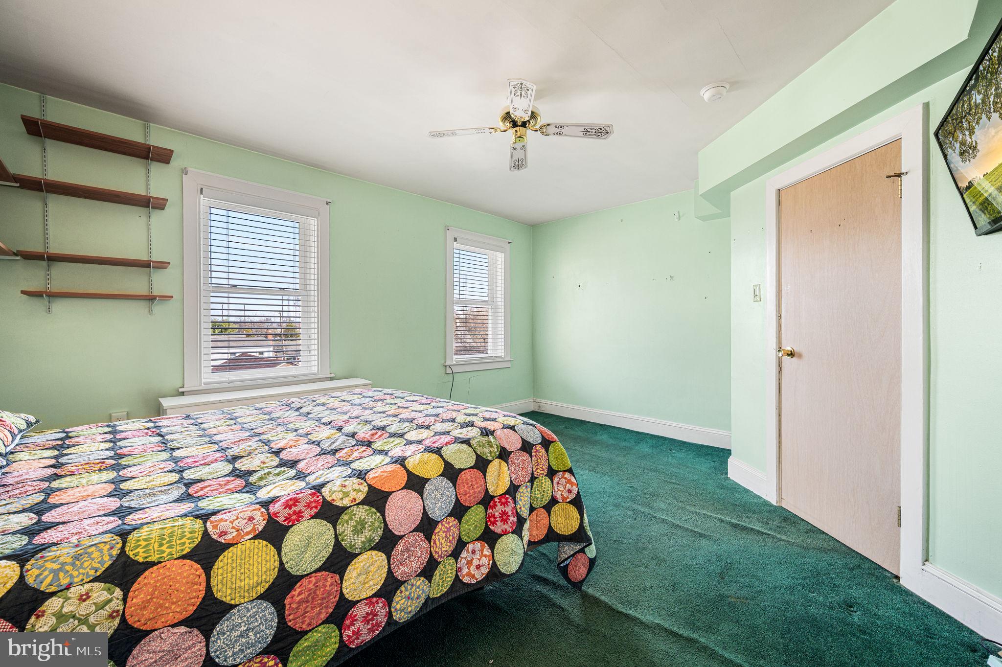 235 Ardmore Avenue Upper Darby, PA 19082 - Photo 14 of 23 a bedroom with a bed and a window