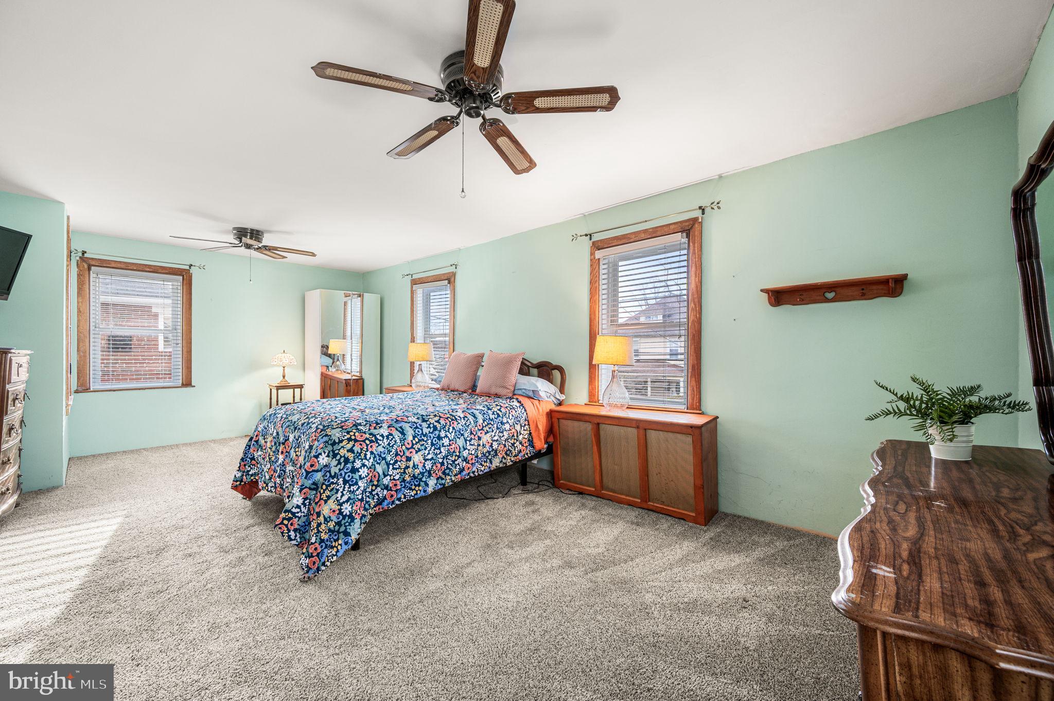 235 Ardmore Avenue Upper Darby, PA 19082 - Photo 15 of 23 a bedroom with a bed and a dresser