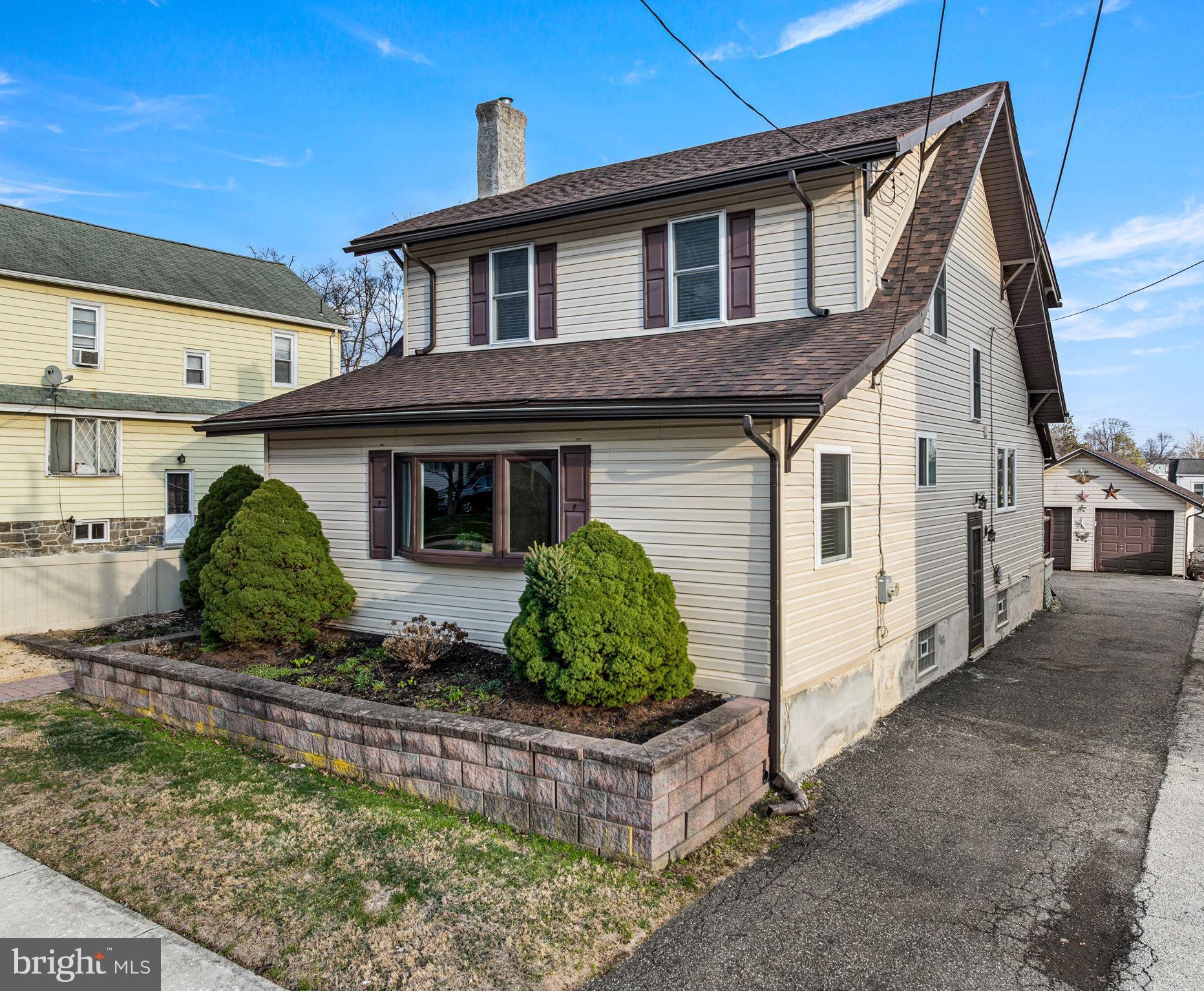 235 Ardmore Avenue Upper Darby, PA 19082 - Photo 23 of 23 a front view of a house with garden