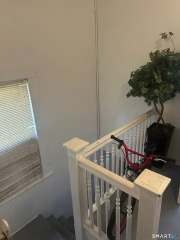 a view of entryway with a small yard