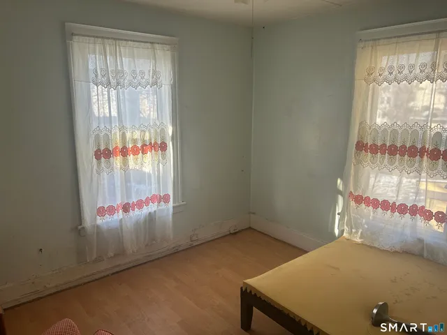 a view of an empty room and window