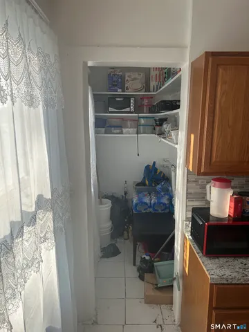 a room with a fireplace and a window