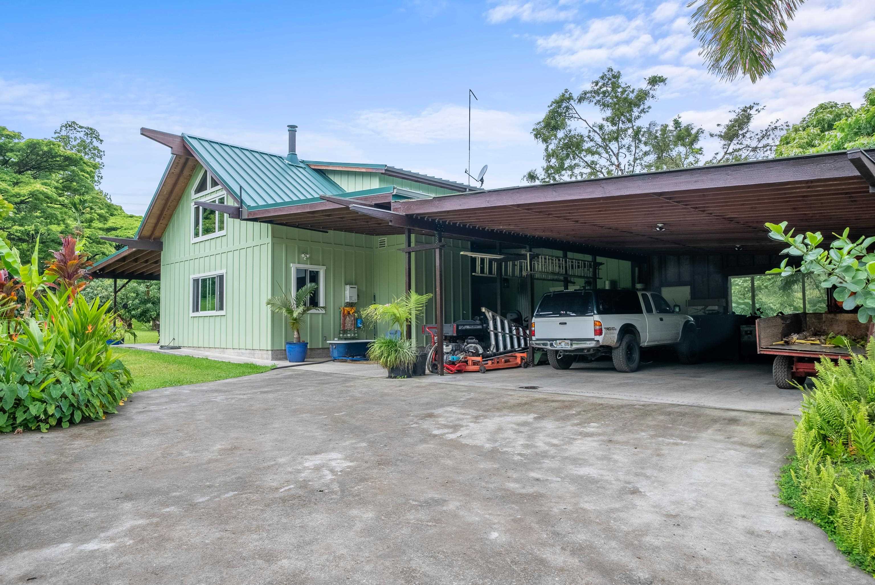 1600 Lower Nahiku Road Hana, HI 96713 - Photo 21 of 23 a view of a house with sitting area and roof deck