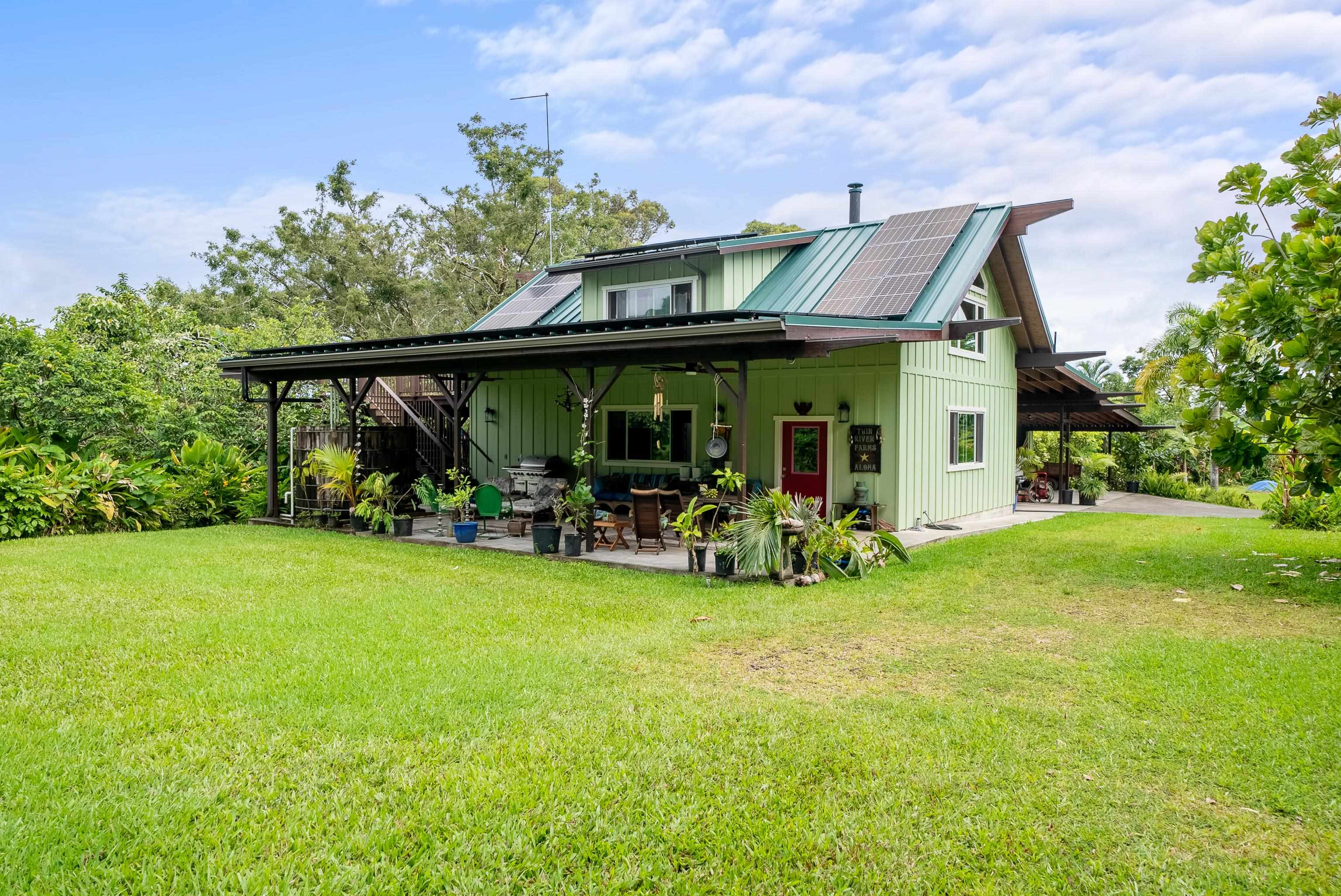 1600 Lower Nahiku Road Hana, HI 96713 - Photo 4 of 23 a view of a house with backyard porch and sitting area