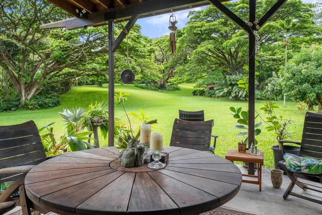 a view of a chairs and table in patio
