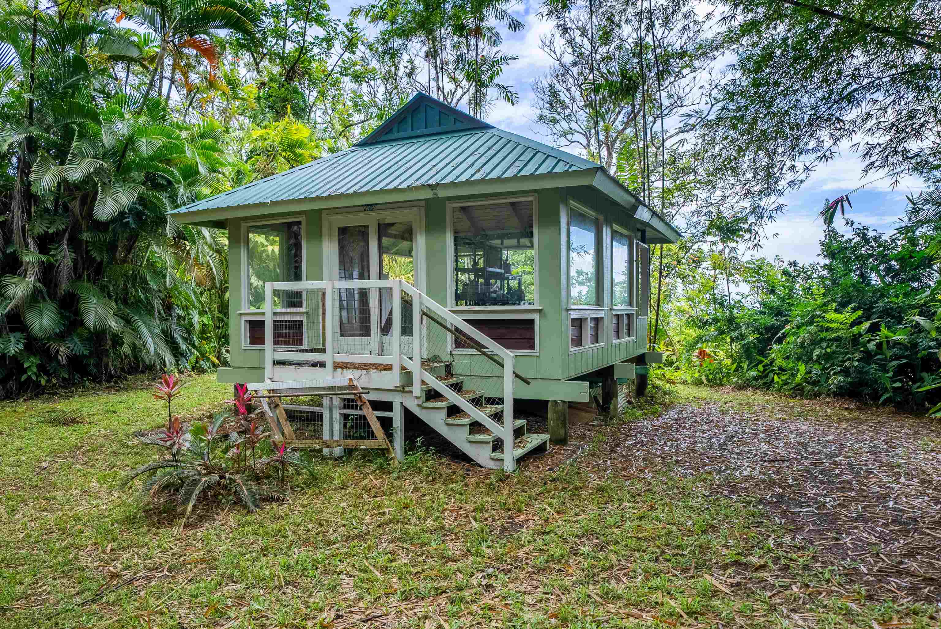 1600 Lower Nahiku Road Hana, HI 96713 - Photo 9 of 23 a front view of a house with garden