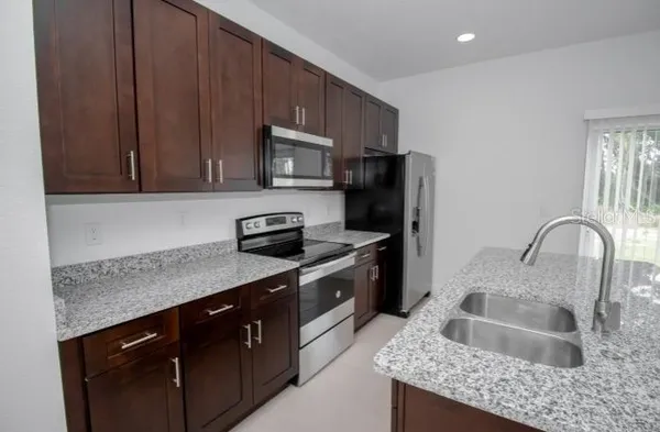 a bedroom with a bed and a mirror