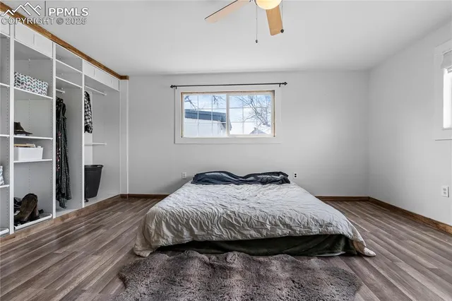 a utility room with lots of clutter and cabinets