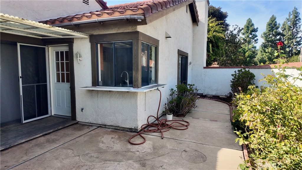 17 Filare Irvine, CA 92620 - Photo 15 of 16 a view of a entryway with flower pots