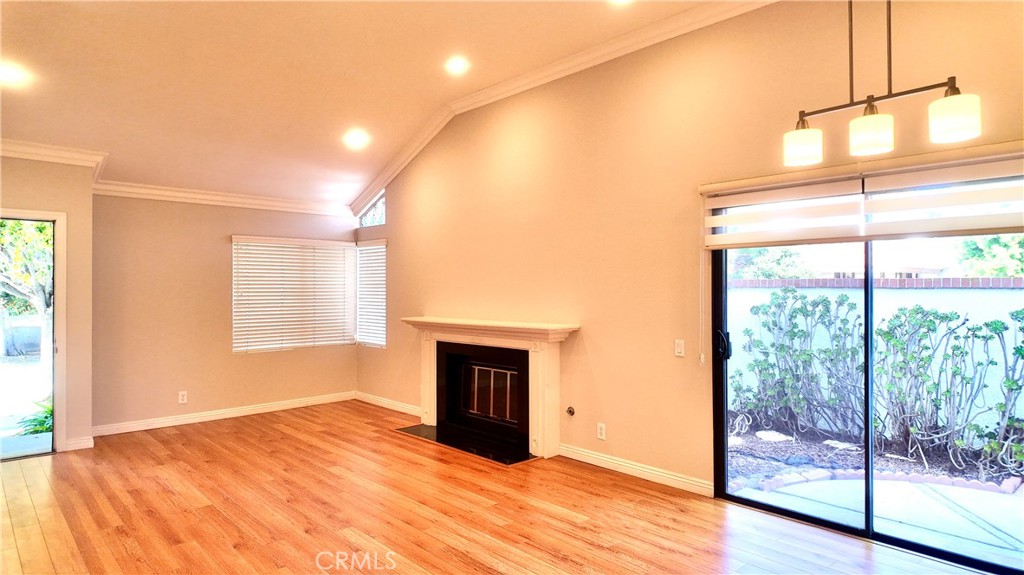 17 Filare Irvine, CA 92620 - Photo 3 of 16 a view of an empty room with a window and wooden floor