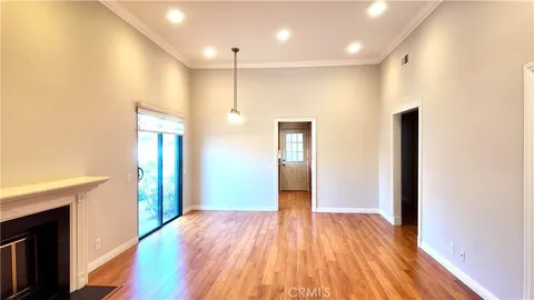 a view of hallway with wooden floor
