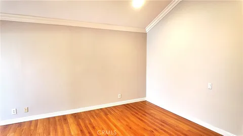 a view of a small space with wooden floor