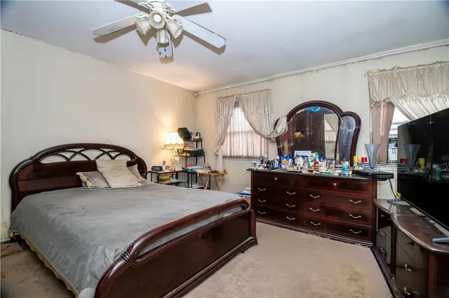 a large white bed in a white room