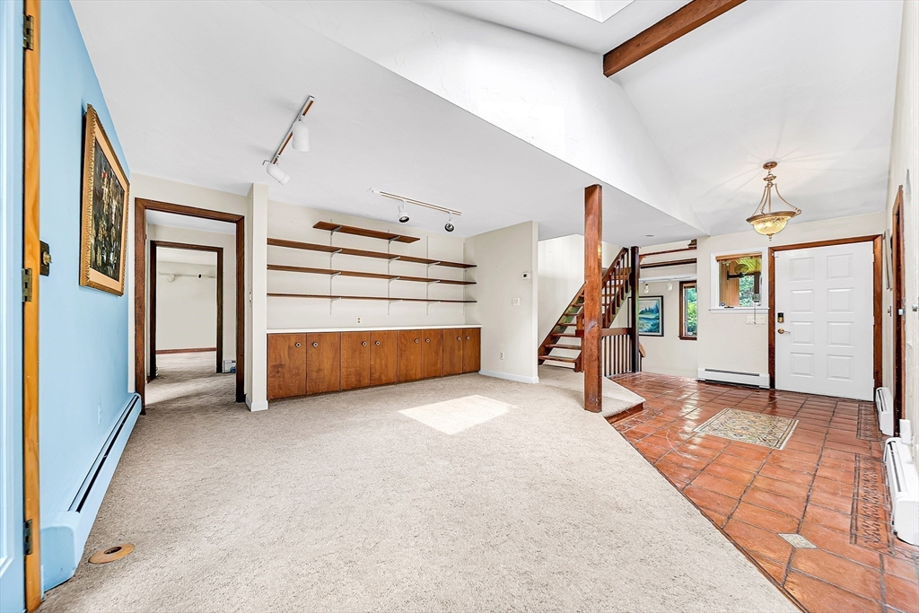 57 South Street Natick, MA 01760 - Photo 16 of 36 a view of a livingroom with furniture and stairs