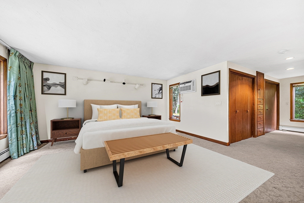57 South Street Natick, MA 01760 - Photo 17 of 36 a spacious bedroom with a bed and a cabinets