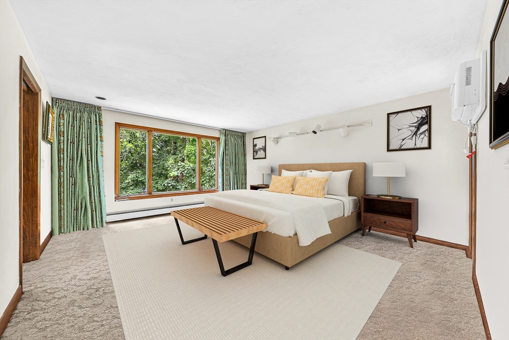 57 South Street Natick, MA 01760 - Photo 19 of 36 a bedroom with a bed and a large window