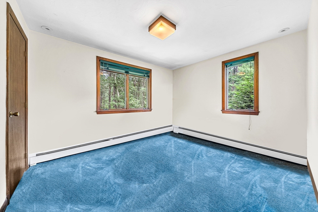 57 South Street Natick, MA 01760 - Photo 22 of 36 an empty room with window and wooden floor