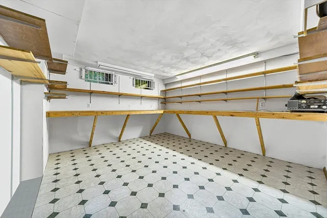 a bathroom with a sink a toilet and a shower